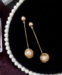 Korean version of the hollow gold silk ball pearl earrings female  temperament long pendant personality exaggerated earrings YLX-123
