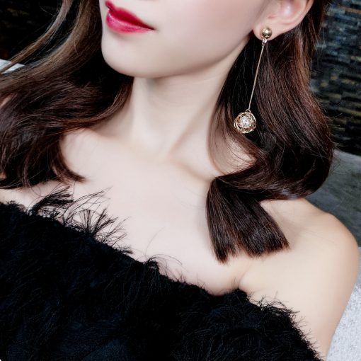 Korean version of the hollow gold silk ball pearl earrings female  temperament long pendant personality exaggerated earrings YLX-123